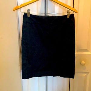 Black lined express skirt, vent in back, slim